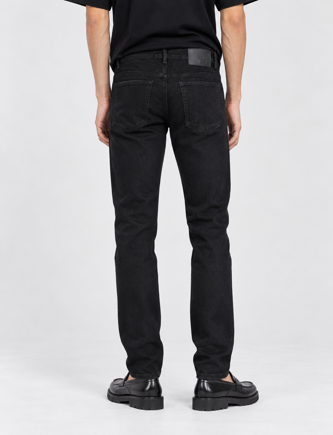 Black tapered jeans – back
